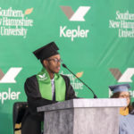 Graduate speaking at podium