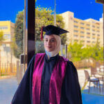 SNHU GEM Graduate standing in regalia